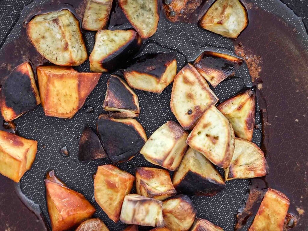 close up image of korean sweet potatoes in pan